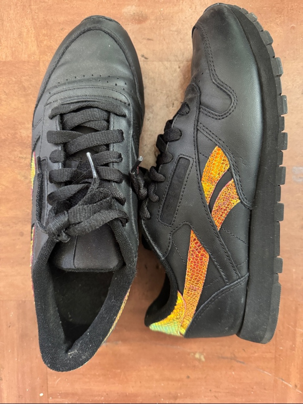 REEBOK Classic Black Leather Sneakers with Orange/Iredescent Textured Accent